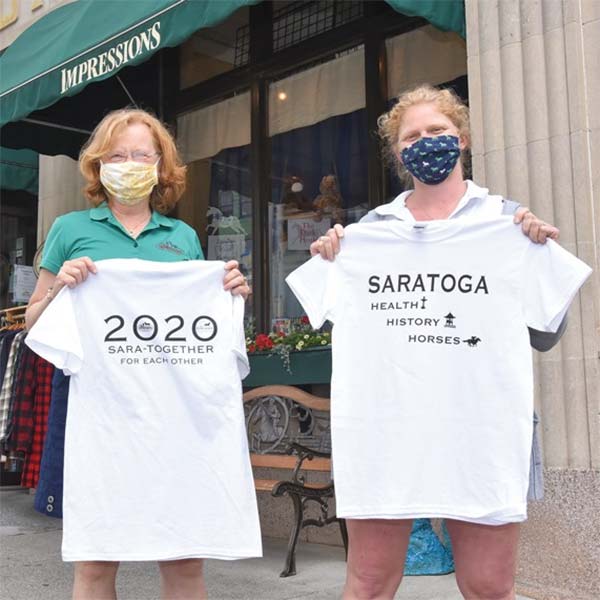 Mare and Maddy holding Saratoga 2020 tshirts