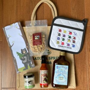 Porch package includes notepad, nuts, pot holder, sea salt rub, hot sauce, BBQ sauce. Free Tote bag