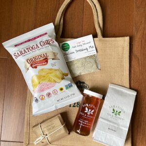 Porch package includes potato chips, dip, honey, tea, local soap. Free Tote bag