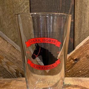 Pint glass- black horse head- red banner above w/Dark Horse- Red banner below Saratoga