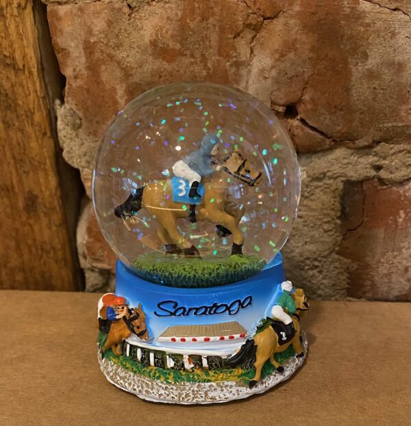Snow globe of racehorse- horses running around base- Saratoga across front of base