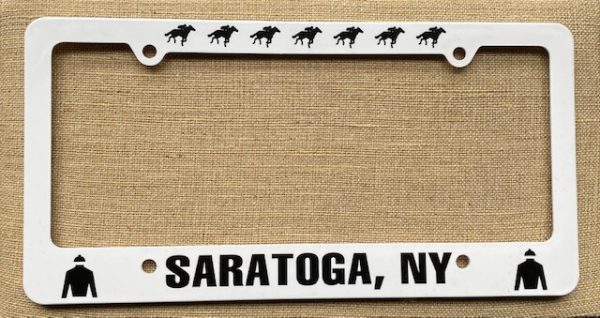License Plate Plastic-white- black racing horses on top- Black Saratoga, NY bottom- Black jockey silk on both ends