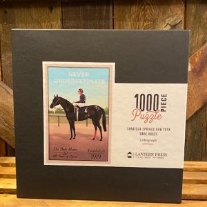 Never Underestimate Puzzle- displayed in box- 1000 pieces- features horse- jockey- never underestimate- The Dark Horse- 100 years of upsets- Established 1919