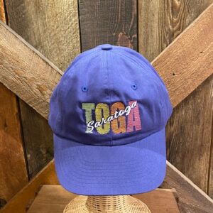 Baseball cap in Royal blue with embroidered "TOGA" in pastel colors with "Saratoga" written across