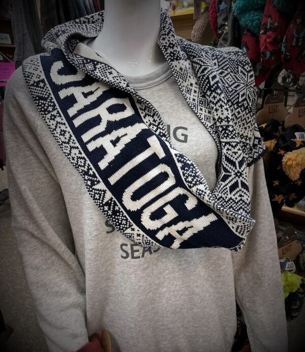 Super soft poly/cotton scarf, double sided design in navy/white with "Saratoga" on it. Displayed on mannequin.Navy/White