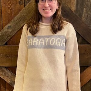 Cotton pull over sweater with grey band that has Saratoga across front. Rolled collar. Adult sizes displayed on model