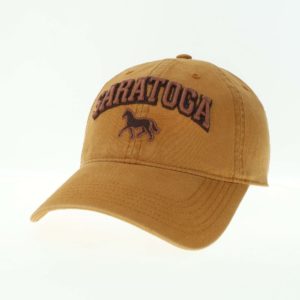 All canvas cap- leather strap with brass slide buckle- color Wheatfield- embroidered "SARATOGA" and horse on front
