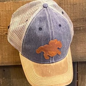 trucker cap- unstructured crown- curved visor- classic fit- tan brim and mesh- denim front- leather patch of horse with SARATOGA across