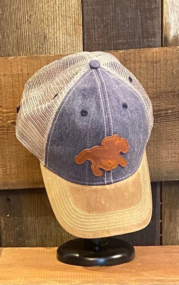 trucker cap- unstructured crown- curved visor- classic fit- tan brim and mesh- denim front- leather patch of horse with SARATOGA across