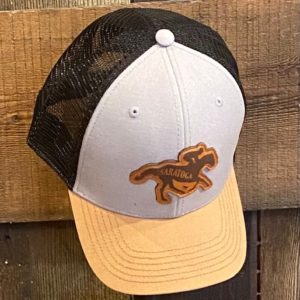 youth cap- unstructured crown- curved visor- classic fit- tan brim-black mesh- grey front- leather patch of horse with SARATOGA across