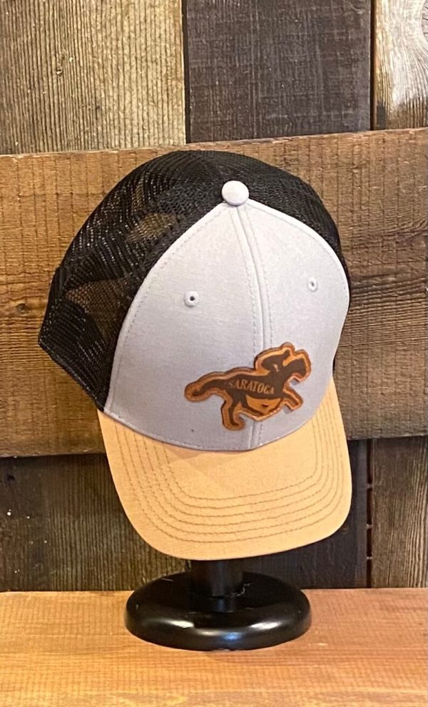 youth cap- unstructured crown- curved visor- classic fit- tan brim-black mesh- grey front- leather patch of horse with SARATOGA across