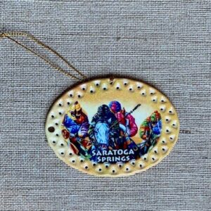 oval yellow and gold ornament featuring Race horses with jockeys- Saratoga Springs- vivid colors
