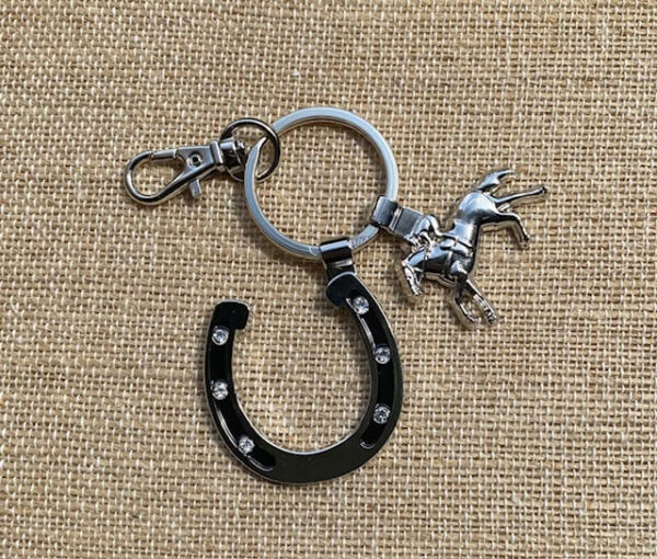 silver keychain with a horseshoe- 6 crystals in horseshoe- horse and jockey charm