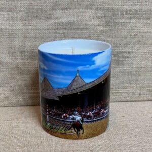 a candle featuring an actual photo of Saratoga race track and grandstand