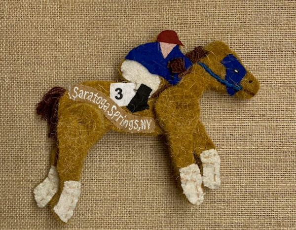wool horse shaped ornament with a jockey-blue silks- Saratoga Springs NY