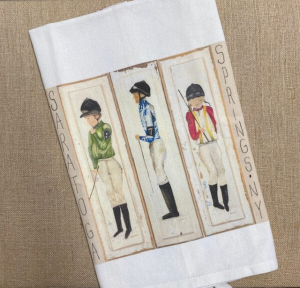 tea towel featuring 3 jockeys. Each wearing different silks. Green, blue, red