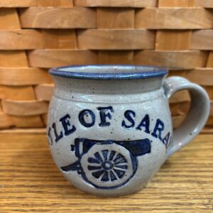 Blue grey barrel mug. Blue trim-Battle of Saratoga" across front with cannon below- in blue